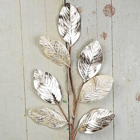 ISB78100- 27in Metalic Magnolia Lvs Spray-Champaigne