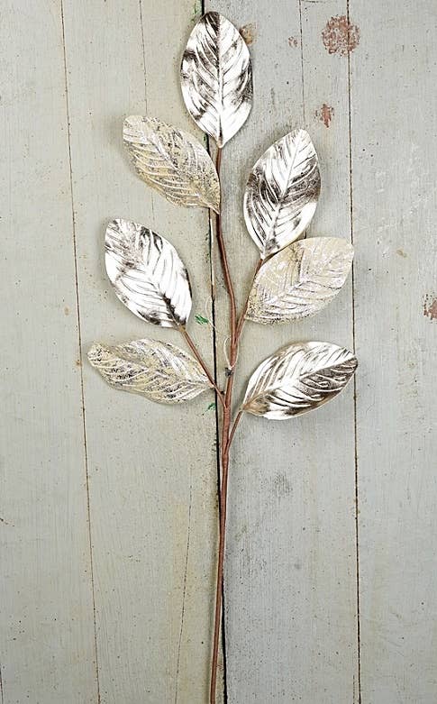 ISB78100- 27in Metalic Magnolia Lvs Spray-Champaigne